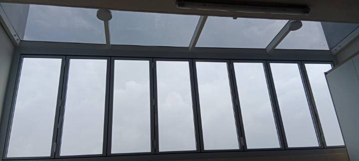 Nano-ceramic window film applied to bi-fold balcony doors in a Singapore condominium